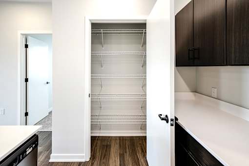 Studio, one two and three bedroom apartments and townhomes featuring open concept floor plans, dens, large windows, stainless steel appliances, quartz countertops, eat-in kitchens, pantries, LVT flooring and much more at The Trails at North Streams in Omaha, NE