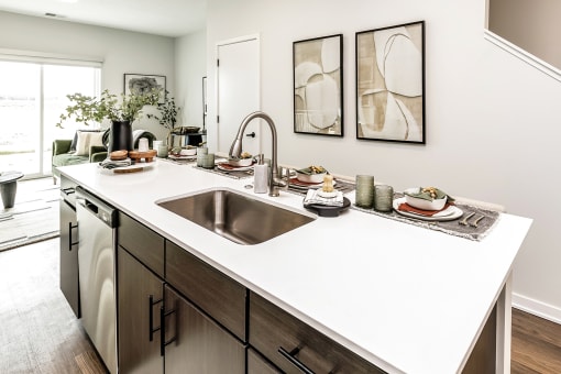 Studio, one two and three bedroom apartments and townhomes featuring open concept floor plans, dens, large windows, stainless steel appliances, quartz countertops, eat-in kitchens, pantries, LVT flooring and much more at The Trails at North Streams in Omaha, NE