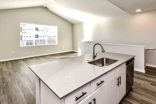 Studio, one two and three bedroom apartments and townhomes featuring open concept floor plans, dens, large windows, stainless steel appliances, quartz countertops, eat-in kitchens, pantries, LVT flooring and much more at The Trails at North Streams in Omaha, NE