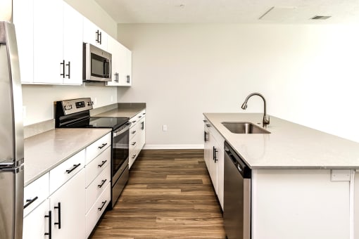 Studio, one two and three bedroom apartments and townhomes featuring open concept floor plans, dens, large windows, stainless steel appliances, quartz countertops, eat-in kitchens, pantries, LVT flooring and much more at The Trails at North Streams in Omaha, NE