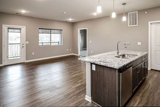 Studio, one two and three bedroom apartment homes featuring stainless steel appliances, luxury wood-style plank flooring, and in-unit washer and dryer in VUE 156 in Omaha, NE