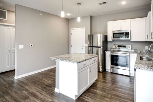 Studio, one two and three bedroom apartment homes featuring stainless steel appliances, luxury wood-style plank flooring, and in-unit washer and dryer in VUE 156 in Omaha, NE