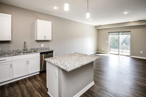 Studio, one two and three bedroom apartment homes featuring stainless steel appliances, luxury wood-style plank flooring, and in-unit washer and dryer in VUE 156 in Omaha, NE