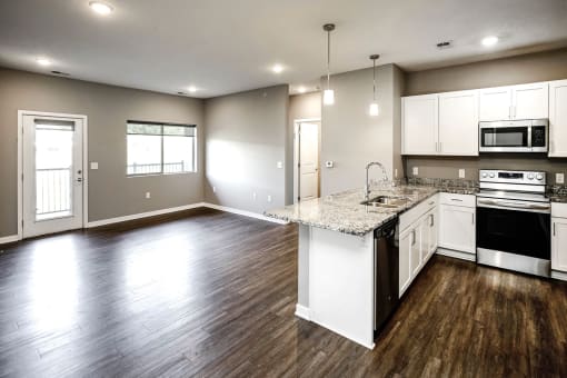 Studio, one two and three bedroom apartment homes featuring stainless steel appliances, luxury wood-style plank flooring, and in-unit washer and dryer in VUE 156 in Omaha, NE