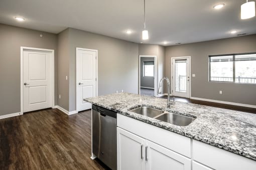 Studio, one two and three bedroom apartment homes featuring stainless steel appliances, luxury wood-style plank flooring, and in-unit washer and dryer in VUE 156 in Omaha, NE