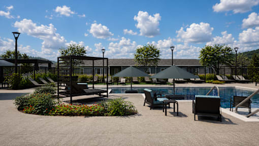 A pool area with a large building in the background.