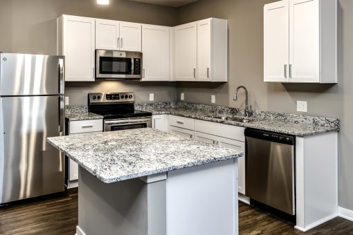 White cabinet countertops at LIV 156 Apartments in Omaha, NE