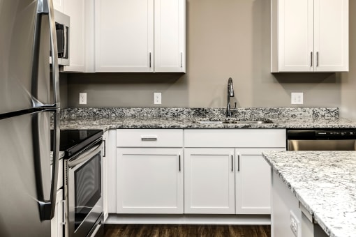 White cabinet countertops at LIV 156 Apartments in Omaha, NE