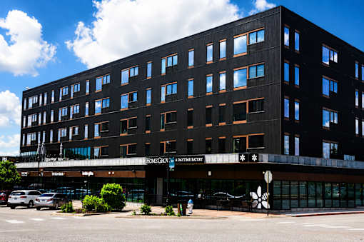 A large black building with a sign that says "HOMEGROWN" on it.