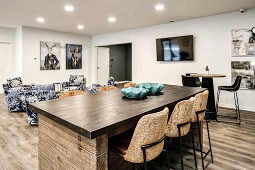 VUE 19 (Clubhouse) - Modern dining room with a wooden table and chairs.