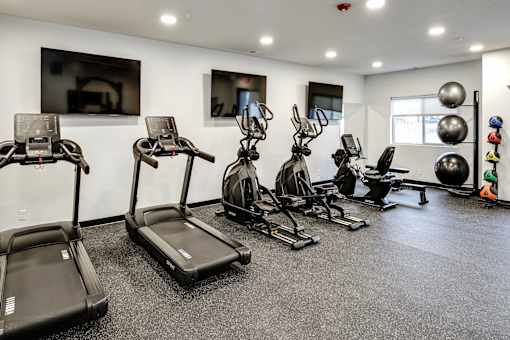 VUE 19 (Fitness Center)  A gym with treadmills, exercise bikes, and other equipment.