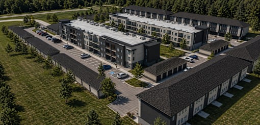 A large building complex with multiple buildings and parking lots.