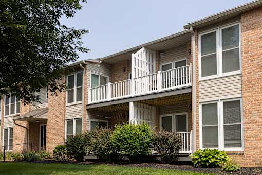 A brick apartment building with a balcony on the second floor. at Brookfield Apartments, Pennsylvania