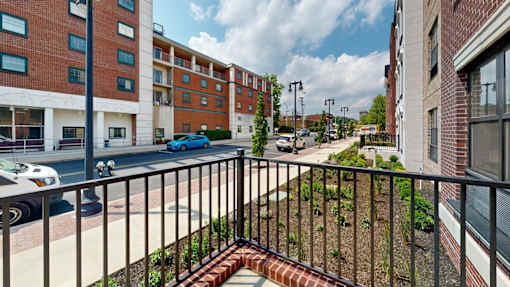 Street view from private balcony with railing at The Confluence Apartments, Easton, Pennsylvania
