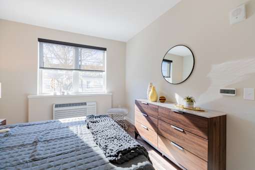 Bedroom with cozy bed at Walnut View Apartments, Allentown