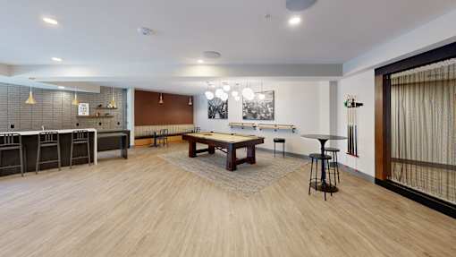 A room with a long wooden table and chairs at The Standard Apartments, Allentown, Pennsylvania
