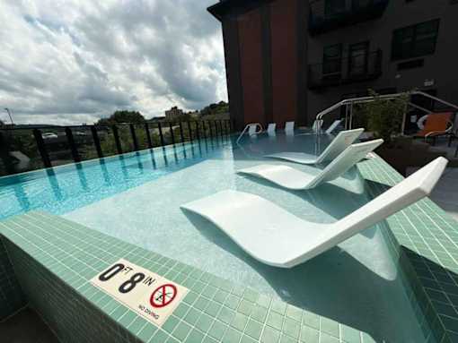 A pool with a sign that says 0'8" no diving.
