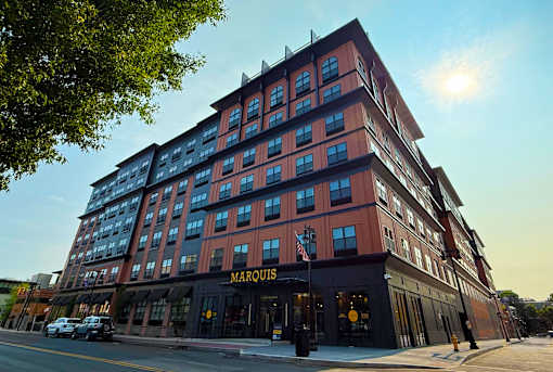 A large red building with the word "Marquis" on the front.
