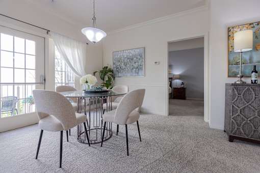 Bright dining room with a glass table at Saucon View Apartments, Bethlehem, PA