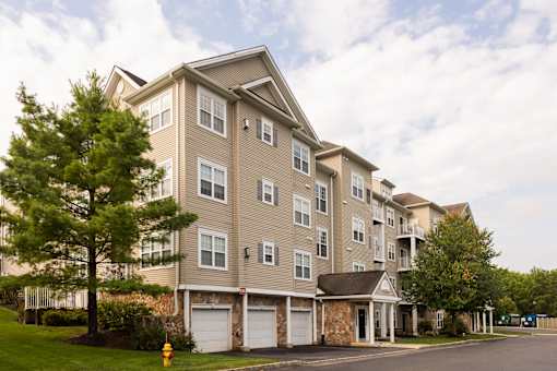 A large apartment building with a parking lot in front at Saucon View Apartments, Pennsylvania, 18015