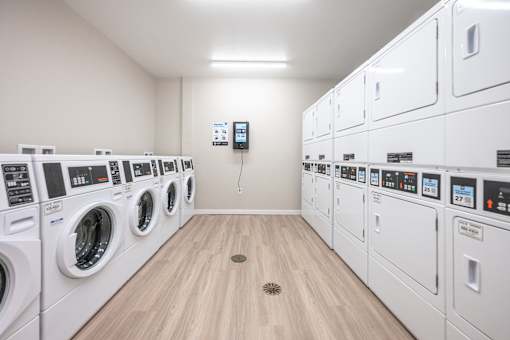 A row of washing machines in a laundromat.