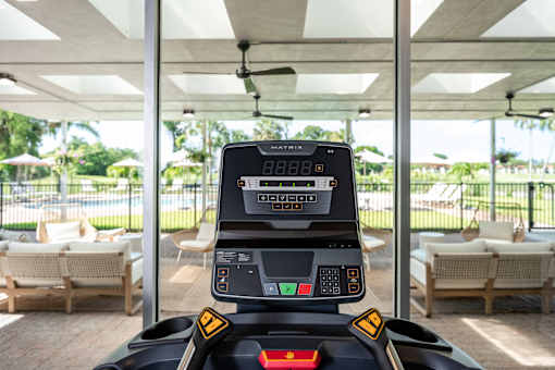 A control panel for a robotic lawnmower is shown with a digital display and several buttons.
