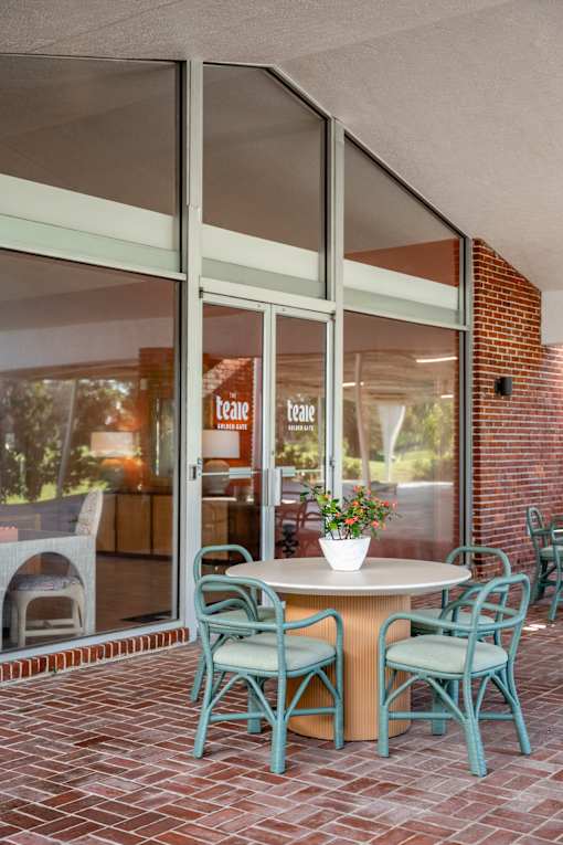 A glass door with the word "tea" written on it.