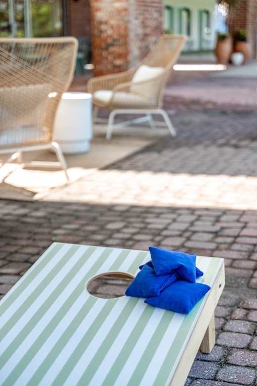 A wooden table with a blue pillow on it.