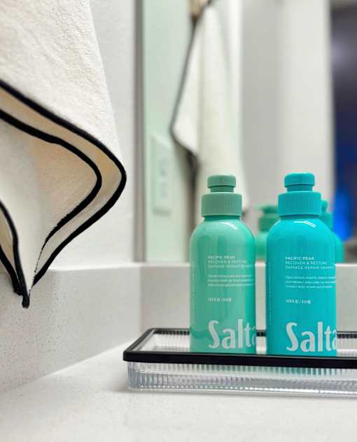 Two bottles of salt water are on a shelf at The Teale Siesta Lago in Kissimmee, FL, 34746