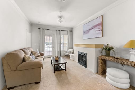 a living room with a couch and a fireplace