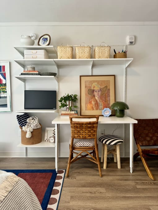a workspace with a desk and a chair in a living room at The Teale Navy Yard, North Charleston, South Carolina