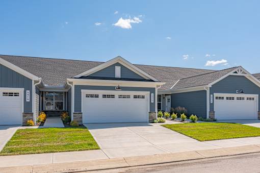 A two-story house with a garage on each floor.