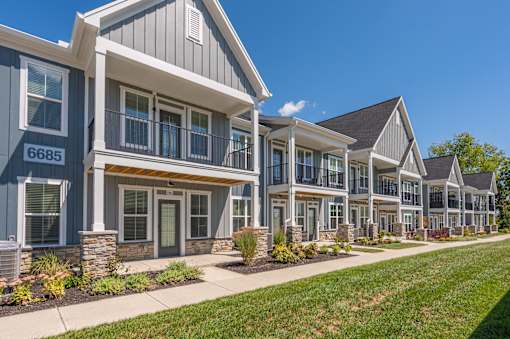 A row of houses with the number 6685 on the front of the first one.