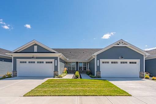 A two-story house with a garage on each floor.