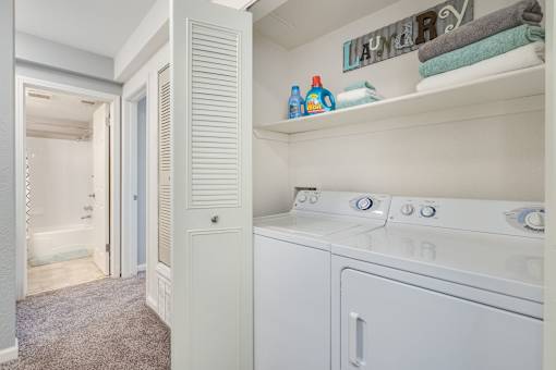 A laundry room with a washer and dryer.