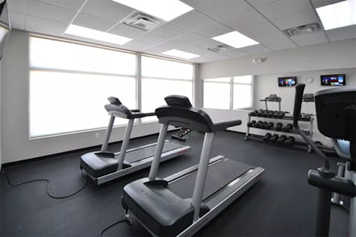 Fitness Center at Living room at Southfield MI Apartments | 42 West Apartments in Southfield Michigan