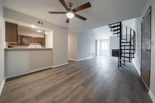 Dining area and staircase at Alpine Slopes Apartments near Grand Rapids, MI
