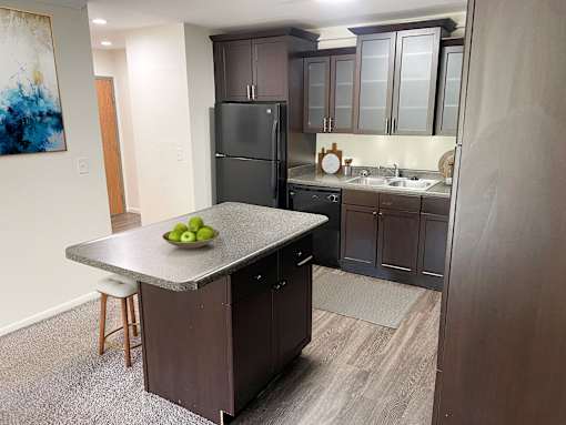 A spacious kitchen at apartments in East Lansing near Michigan State University | Americana Apartments in East Lansing, Michigan