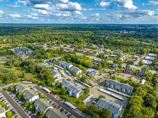 an aerial view of a neighborhood with houses and trees