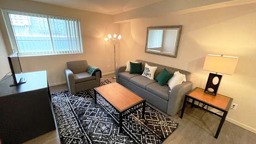 a living room with couches and a table