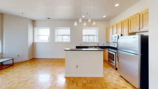 a kitchen with an island in the middle of the room