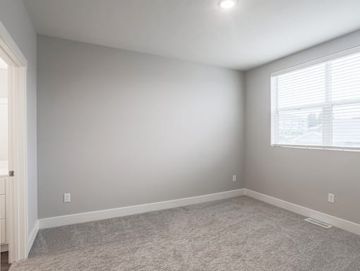 Bedroom at apartments in Haslett, Michigan | Newton Place Apartments in Haslett MI