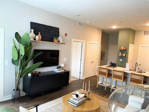 Spacious living room and kitchen at Newton Place Apartments in Haslett, Michigan