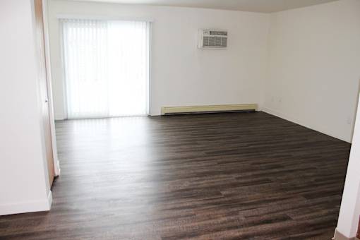 Living room at Whispering Pines Apartments in Holland, Michigan