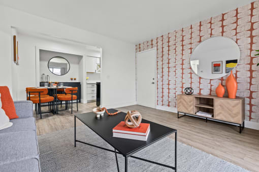 a living room with a couch and a coffee table  at Park On Canal Apartments, Clinton Twp, Michigan