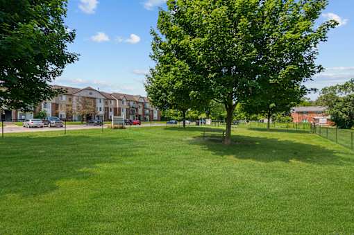 Lush Green Landscape at Residences at Grand Blanc Apartments - Grand Blanc, MI, Michigan, 48507