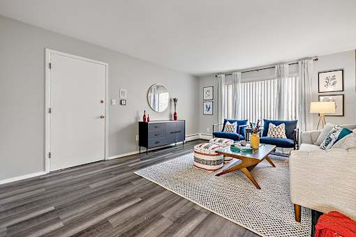 spacious living room with couch and coffee table at the adelaide apartments