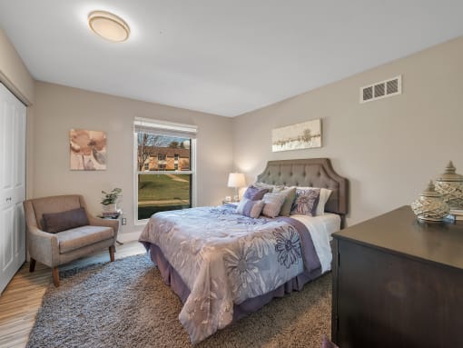 Spacious Bedroom With Comfortable Bed at Rochester Club Apartments - Rochester, MI, Michigan