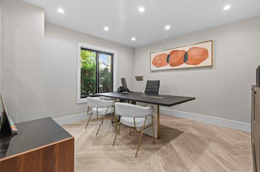 A conference room with a long table and chairs at Park On Canal Apartments - Clinton Twp, MI Apartments, Michigan, 48038
