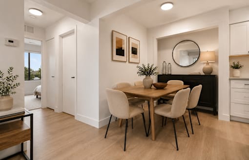A dining room with a wooden table and chairs. at Park On Canal Apartments - Clinton Twp, MI Apartments, Clinton Twp, Michigan